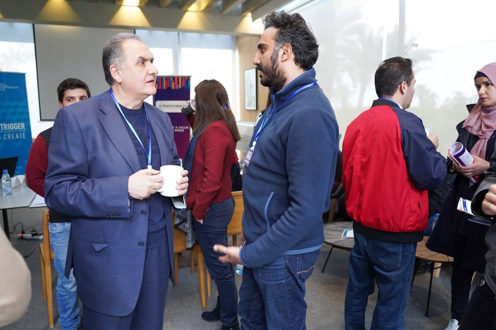 Participants and guests talk during a networking break