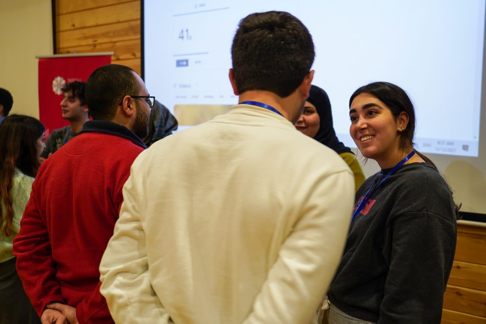 Participants talk in small groups between bootcamp sessions