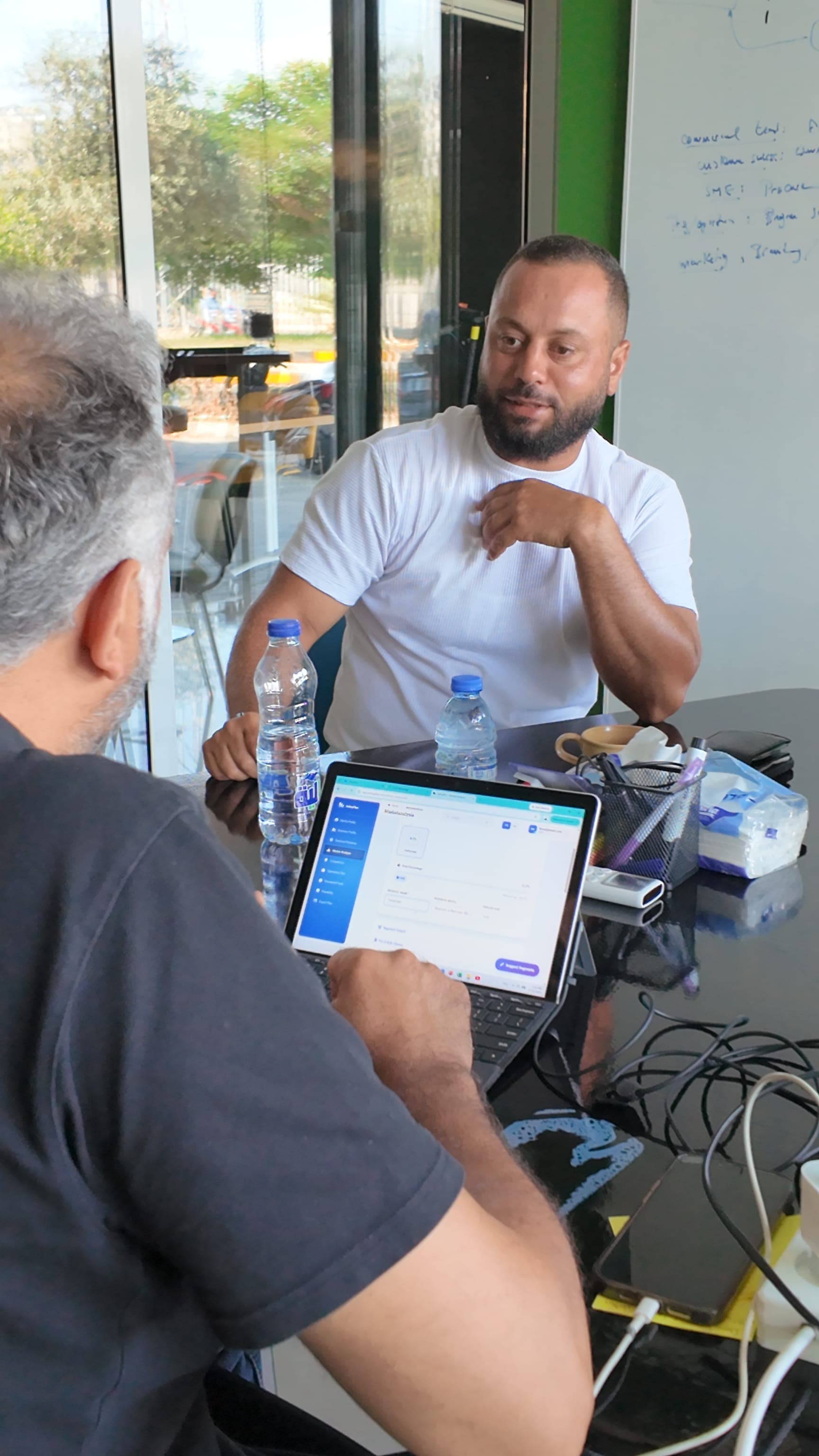 Founder working on a business plan at a laptop